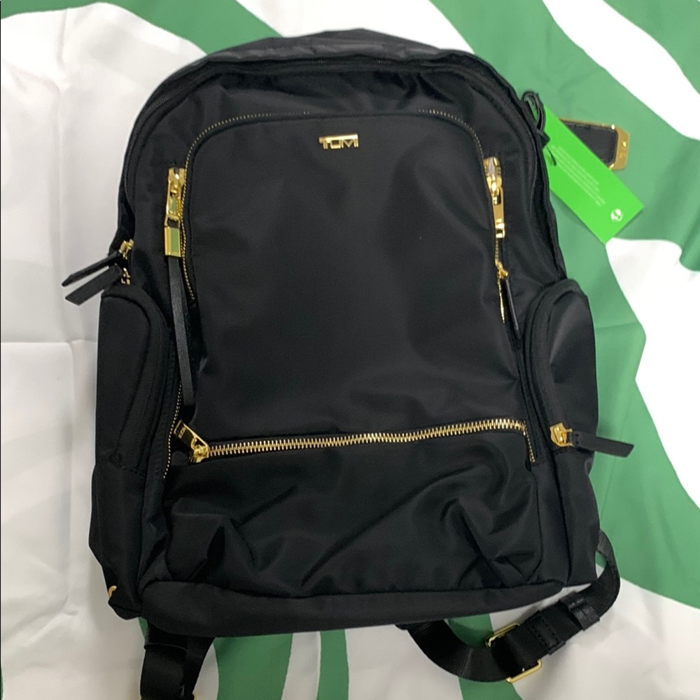 Tumi Black Backpack with Gold Accents